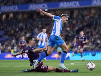 Sergio Alvarez of SD Eibar competes for the ball with Yeremay Hernandez of RC Deportivo de La Coruna during the LaLiga Hypermotion match bet...