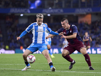 Hodei Arrillaga of SD Eibar competes for the ball with David Mella of RC Deportivo de La Coruna during the LaLiga Hypermotion match between...