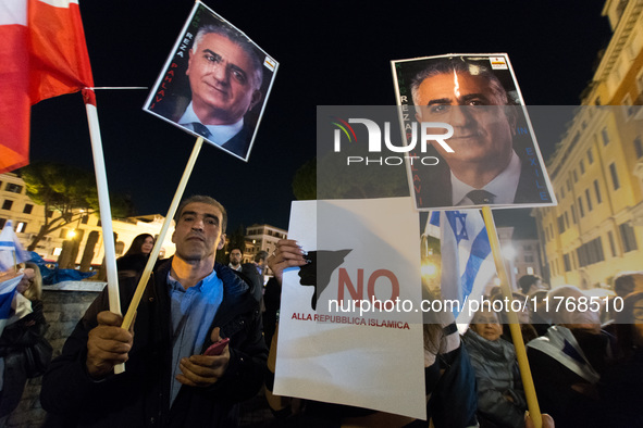 In Rome, Italy, on November 11, 2024, people hold Israeli flags, a sign reading 'no to the Islamic republic,' and a portrait of former Shah...