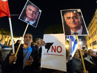 In Rome, Italy, on November 11, 2024, people hold Israeli flags, a sign reading 'no to the Islamic republic,' and a portrait of former Shah...