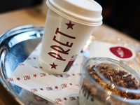 Pret logo is seen on a cup of coffee in this illustration photo taken in Berlin, Germany on November 10, 2024. (