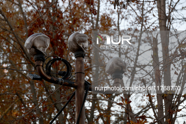 A melted street lamp is outside a cafe building burned down by Russian shelling in Kherson, Ukraine, on November 7, 2024. NO USE RUSSIA. NO...