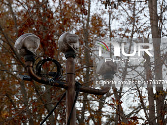 A melted street lamp is outside a cafe building burned down by Russian shelling in Kherson, Ukraine, on November 7, 2024. NO USE RUSSIA. NO...