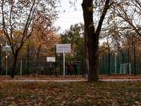 Men play basketball on the sports ground in Kherson, Ukraine, on November 7, 2024. (