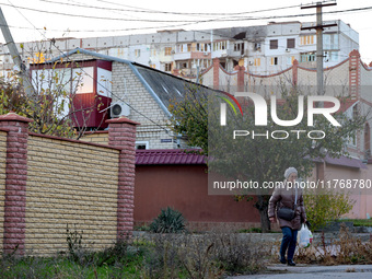 A local resident is seen on the street in Kherson, Ukraine, on November 7, 2024. (