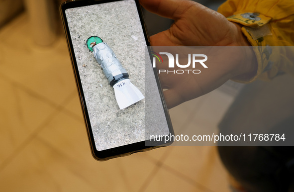 A photo on a smartphone shows a device dropped by the Russians from a drone in Kherson, Ukraine, on November 7, 2024. NO USE RUSSIA. NO USE...