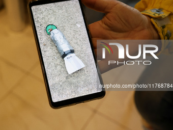 A photo on a smartphone shows a device dropped by the Russians from a drone in Kherson, Ukraine, on November 7, 2024. NO USE RUSSIA. NO USE...