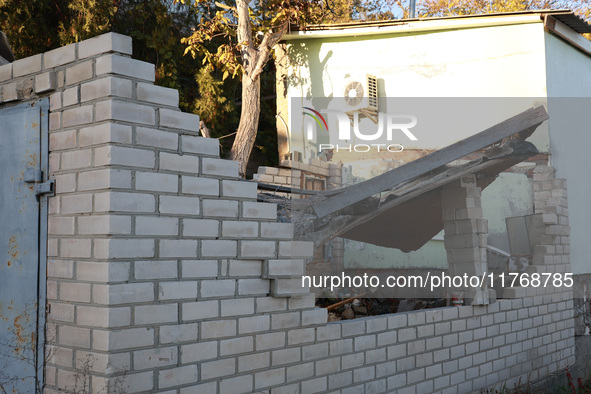 A fence damaged by Russian shelling in Kherson, Ukraine, on November 7, 2024. 