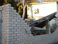 A fence damaged by Russian shelling in Kherson, Ukraine, on November 7, 2024. (