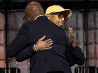 Pharrell Williams, an artist and entrepreneur, and Frank Cooper, CMO at Visa, are present on the center stage during the opening night of We...