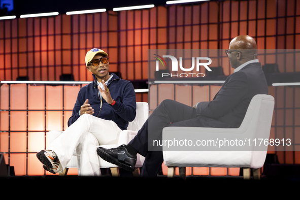 Pharrell Williams, an artist and entrepreneur, and Frank Cooper, CMO at Visa, are present on the center stage during the opening night of We...