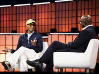 Pharrell Williams, an artist and entrepreneur, and Frank Cooper, CMO at Visa, are present on the center stage during the opening night of We...