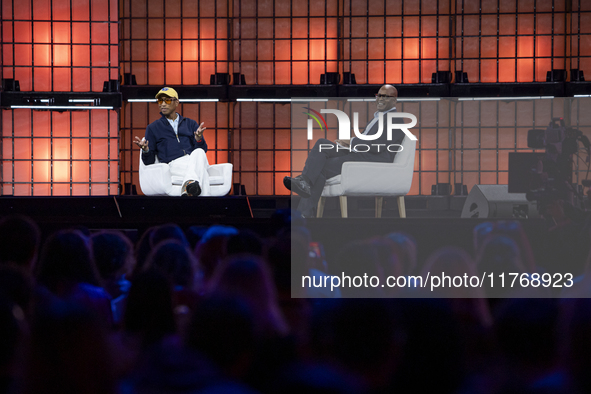 Pharrell Williams, an artist and entrepreneur, and Frank Cooper, CMO at Visa, are present on the center stage during the opening night of We...