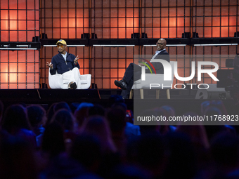 Pharrell Williams, an artist and entrepreneur, and Frank Cooper, CMO at Visa, are present on the center stage during the opening night of We...