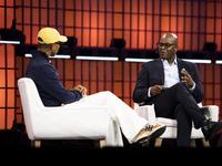 Pharrell Williams, an artist and entrepreneur, and Frank Cooper, CMO at Visa, are present on the center stage during the opening night of We...