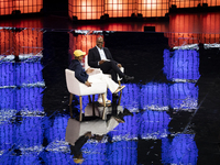 Pharrell Williams, an artist and entrepreneur, and Frank Cooper, CMO at Visa, are present on the center stage during the opening night of We...