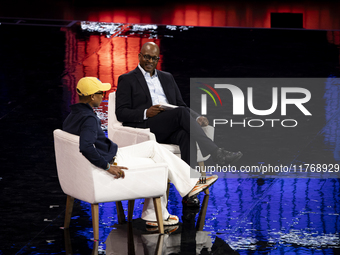 Pharrell Williams, an artist and entrepreneur, and Frank Cooper, CMO at Visa, are present on the center stage during the opening night of We...