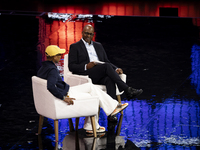 Pharrell Williams, an artist and entrepreneur, and Frank Cooper, CMO at Visa, are present on the center stage during the opening night of We...