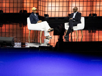 Pharrell Williams, an artist and entrepreneur, and Frank Cooper, CMO at Visa, are present on the center stage during the opening night of We...