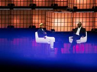 Pharrell Williams, an artist and entrepreneur, and Frank Cooper, CMO at Visa, are present on the center stage during the opening night of We...