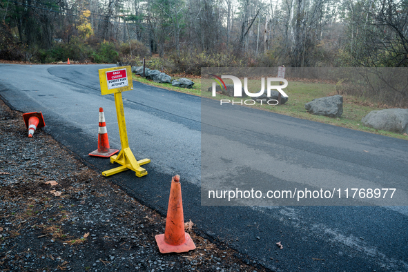 An area closed sign is on Old Forge Road in Orange County, New York, as wildfires burn along the New York and New Jersey border on November...