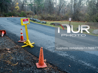 An area closed sign is on Old Forge Road in Orange County, New York, as wildfires burn along the New York and New Jersey border on November...