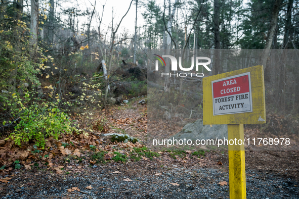 An area closed sign is on Old Forge Road in Orange County, New York, as wildfires burn along the New York and New Jersey border on November...