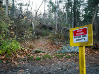 An area closed sign is on Old Forge Road in Orange County, New York, as wildfires burn along the New York and New Jersey border on November...