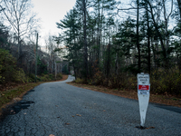 An area closed sign is on Old Forge Road in Orange County, New York, as wildfires burn along the New York and New Jersey border on November...