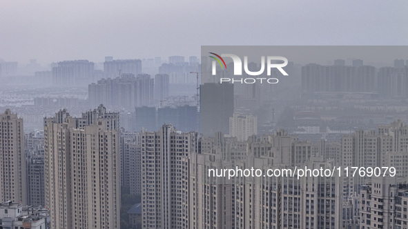 A photo taken in Huai'an, China, on November 12, 2024, shows residential buildings in the urban area of Huai'an City, East China's Jiangsu p...