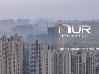 A photo taken in Huai'an, China, on November 12, 2024, shows residential buildings in the urban area of Huai'an City, East China's Jiangsu p...