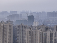 A photo taken in Huai'an, China, on November 12, 2024, shows residential buildings in the urban area of Huai'an City, East China's Jiangsu p...