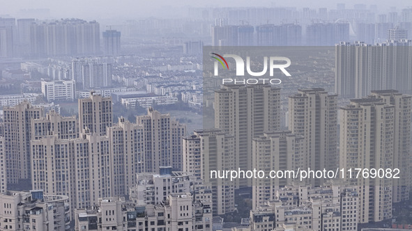 A photo taken in Huai'an, China, on November 12, 2024, shows residential buildings in the urban area of Huai'an City, East China's Jiangsu p...