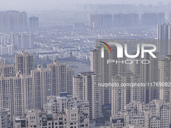 A photo taken in Huai'an, China, on November 12, 2024, shows residential buildings in the urban area of Huai'an City, East China's Jiangsu p...