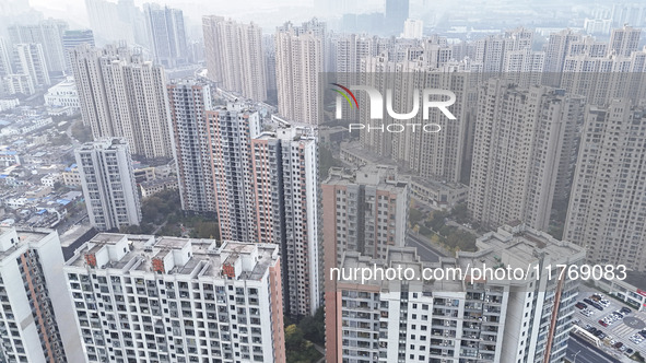 A photo taken in Huai'an, China, on November 12, 2024, shows residential buildings in the urban area of Huai'an City, East China's Jiangsu p...