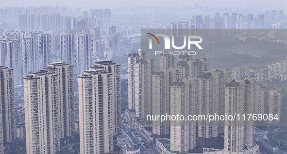 A photo taken in Huai'an, China, on November 12, 2024, shows residential buildings in the urban area of Huai'an City, East China's Jiangsu p...