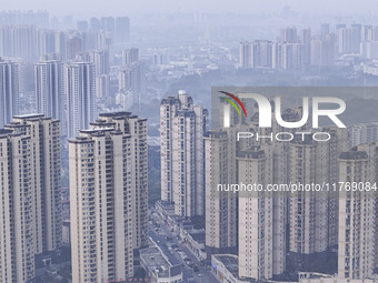 A photo taken in Huai'an, China, on November 12, 2024, shows residential buildings in the urban area of Huai'an City, East China's Jiangsu p...