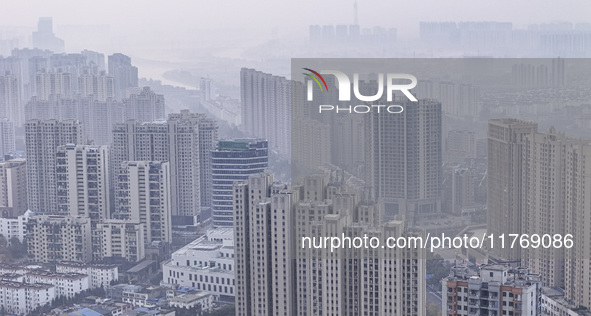 A photo taken in Huai'an, China, on November 12, 2024, shows residential buildings in the urban area of Huai'an City, East China's Jiangsu p...