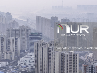 A photo taken in Huai'an, China, on November 12, 2024, shows residential buildings in the urban area of Huai'an City, East China's Jiangsu p...