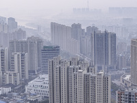 A photo taken in Huai'an, China, on November 12, 2024, shows residential buildings in the urban area of Huai'an City, East China's Jiangsu p...