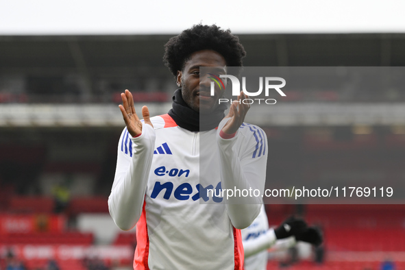 Ola Aina of Nottingham Forest warms up ahead of kick-off during the Premier League match between Nottingham Forest and Newcastle United at t...