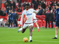 Taiwo Awoniyi of Nottingham Forest warms up ahead of kick-off during the Premier League match between Nottingham Forest and Newcastle United...