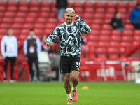 Bruno Guimaraes of Newcastle United warms up ahead of kick-off during the Premier League match between Nottingham Forest and Newcastle Unite...