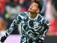 William Osula of Newcastle United balances the ball during the Premier League match between Nottingham Forest and Newcastle United at the Ci...