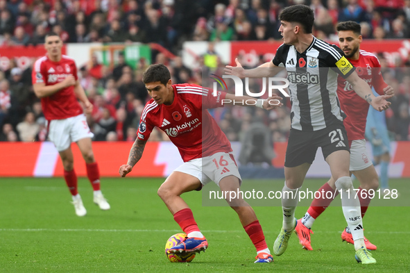 Nicolas Dominguez of Nottingham Forest is under pressure from Tino Livramento of Newcastle United during the Premier League match between No...