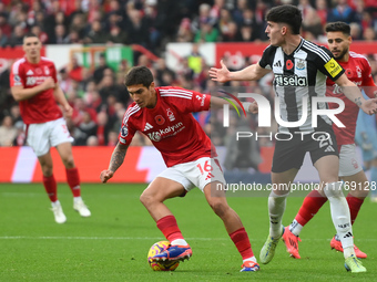 Nicolas Dominguez of Nottingham Forest is under pressure from Tino Livramento of Newcastle United during the Premier League match between No...