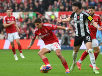 Nicolas Dominguez of Nottingham Forest is under pressure from Tino Livramento of Newcastle United during the Premier League match between No...