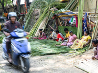 Artisans prepare traditional wedding decorative backgrounds and items for the upcoming wedding season at a street side in Hyderabad, India,...