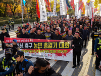 Hundreds of farmers march through the streets of Yeouido as part of the Farmers' General Rally for Agricultural Reform, organized by the Kor...