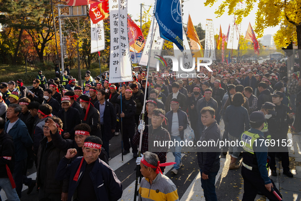 Hundreds of farmers march through the streets of Yeouido as part of the Farmers' General Rally for Agricultural Reform, organized by the Kor...